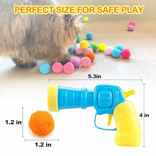 Cat playing with colorful pom-poms and toy blaster.