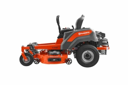 Husqvarna zero-turn lawn mower in action with LED headlights