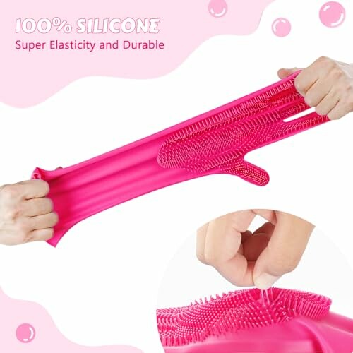 Pink silicone gloves being stretched to show elasticity and durability.