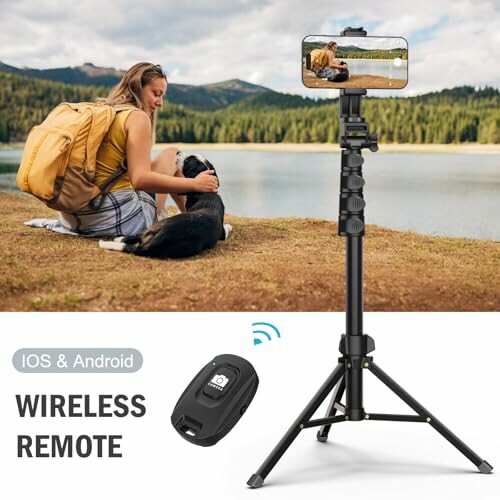 Woman sitting by a lake with a dog, phone mounted on a tripod with wireless remote